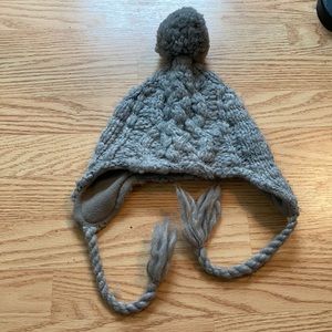 Gray winter hat with ear coverings